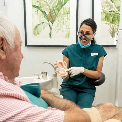 Shenton Park dentist Dr Zara showing patient model of teeth