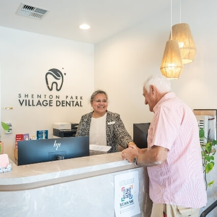 front desk team welcoming patient
