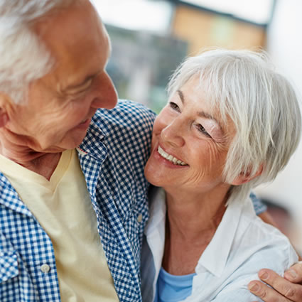 old couple hugs