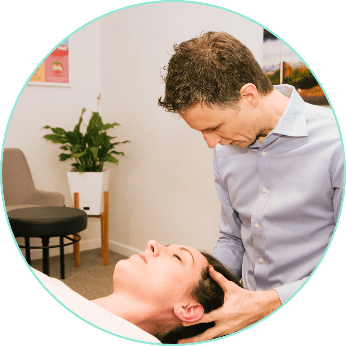 Dr. Comely adjusting patients head