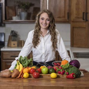 Ashley at the counter with fruits