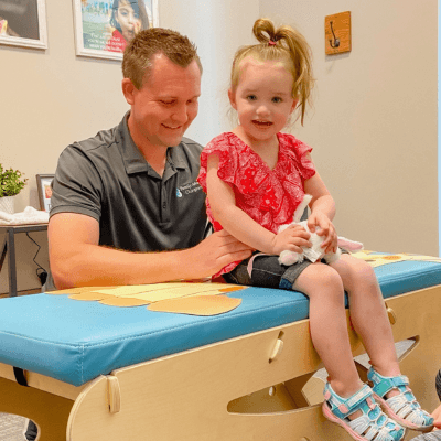Little girl sitting on the table