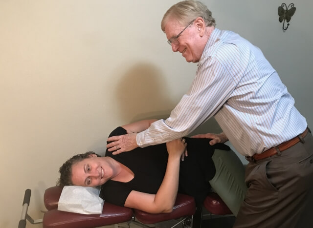 Doctor stretching patient
