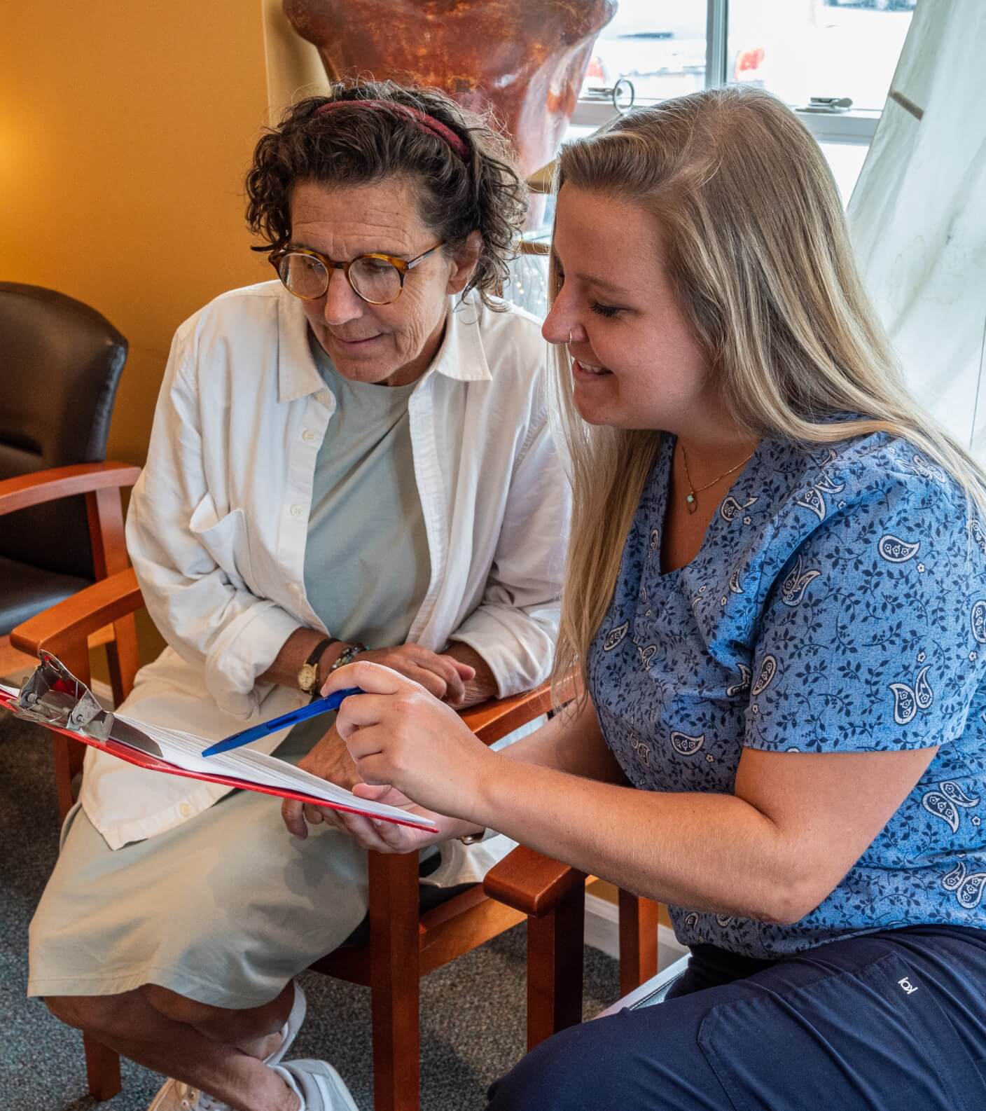 Staff helping patient