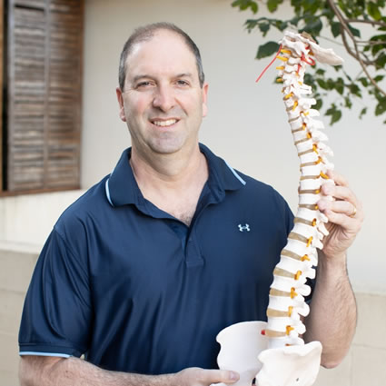 Dr. Dan holding a spine model
