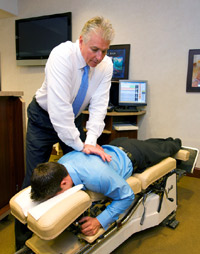Dr. Priestley adjusting a patient. Dr. Priestley adjusting a patient.
