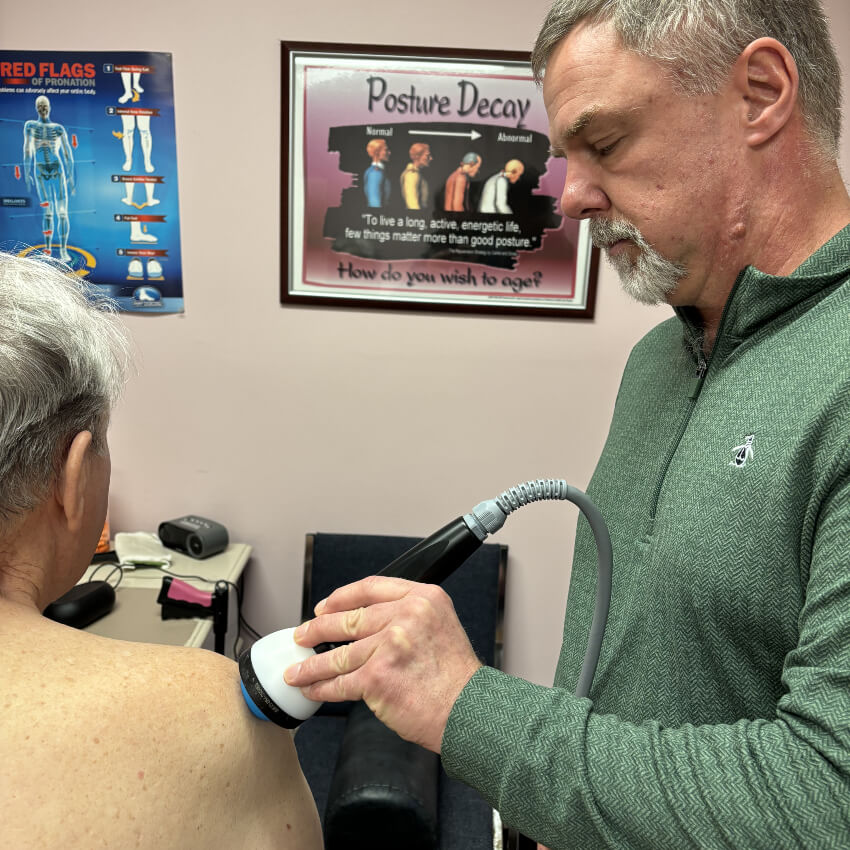 shockwave treatment on patients shoulder