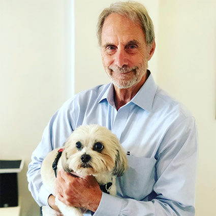 Dr Jeff holding a dog