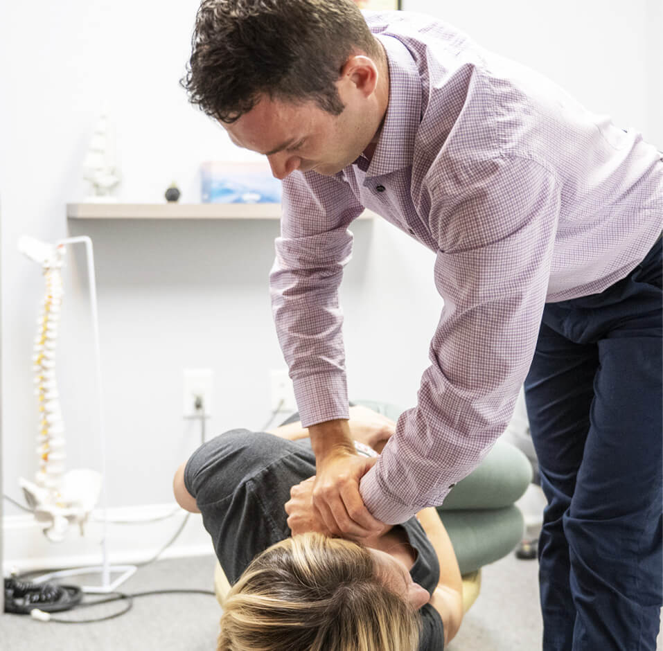 Chiropractor cracking patients back