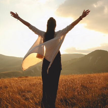 Woman raising her hands in the air