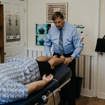 Dr. Baarbe adjusting a patient