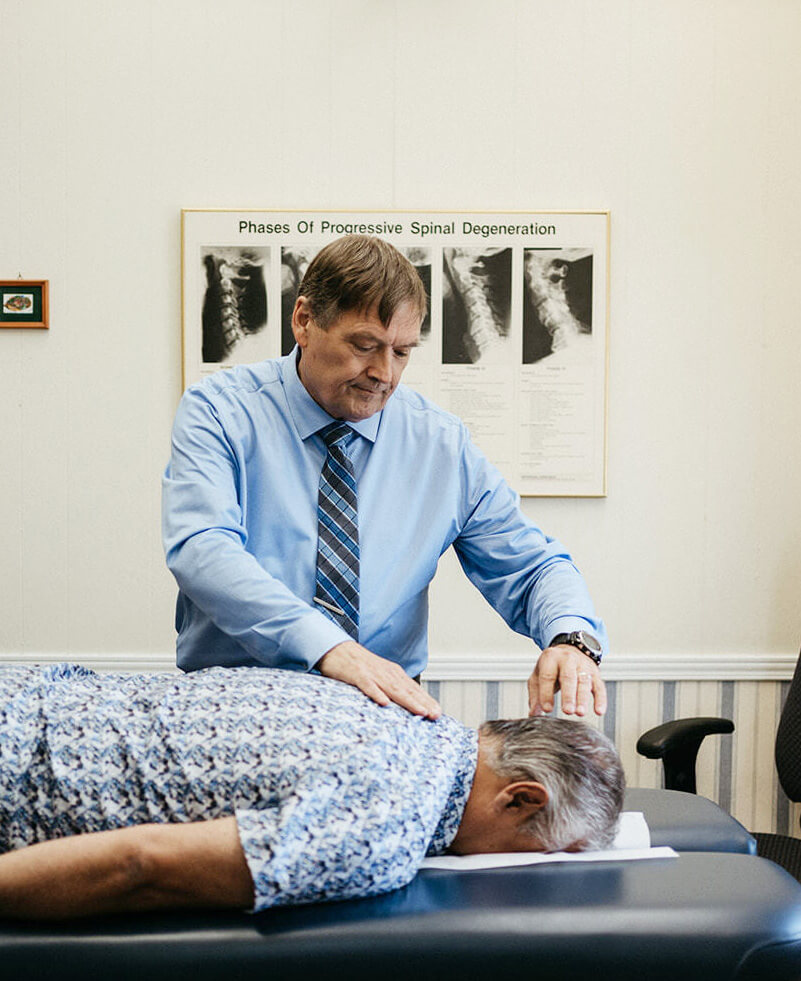 Dr. Johannes Baarbé checking elderly patient