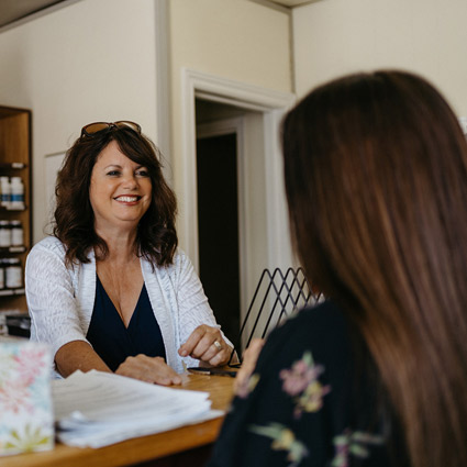 Receptionist greeting a new patient