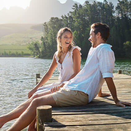 Couple-smiling-on-a-dock