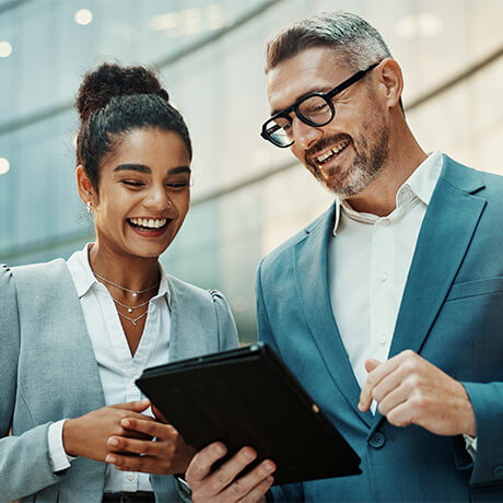 Two professional looking at tablet