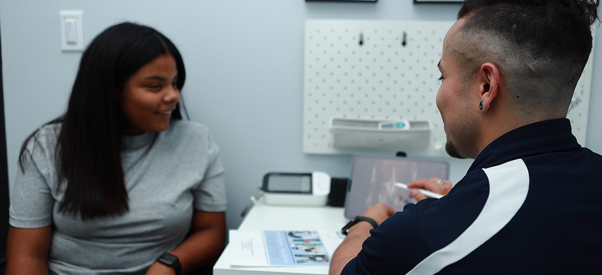 Dr Rich talking with patient