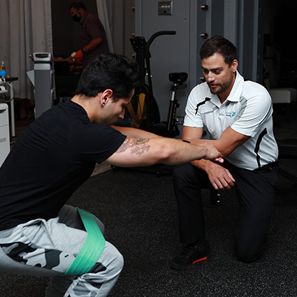 practitioner watching patient exercise