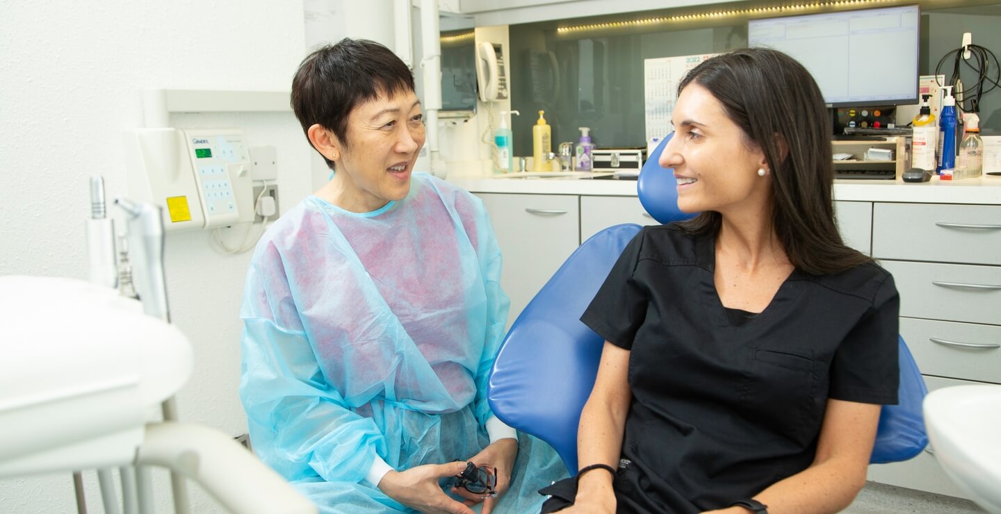 doctor and patient smiling and talking