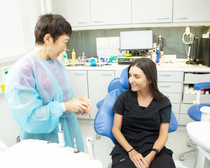patient and dentist talking