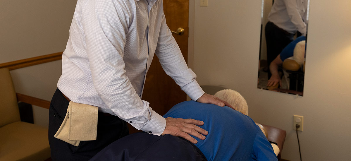 adjusting a patients back