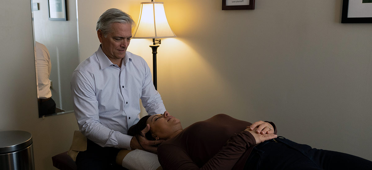 patient getting their neck adjusted