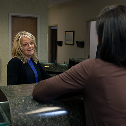 office staff greeting patient