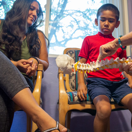 A new patient consultation with a young boy and his mother