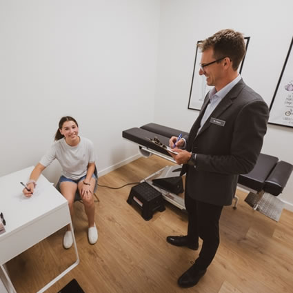 Dr. Peever speaking with a patient