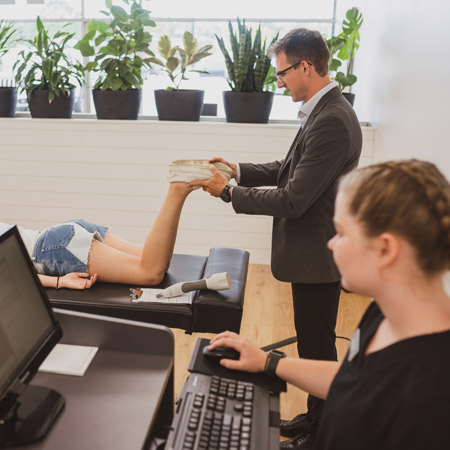 Dr. Peever performing a chiropractic adjustment