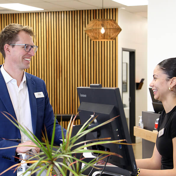 Receptionist welcoming a patient
