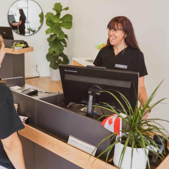 Receptionist welcoming a patient