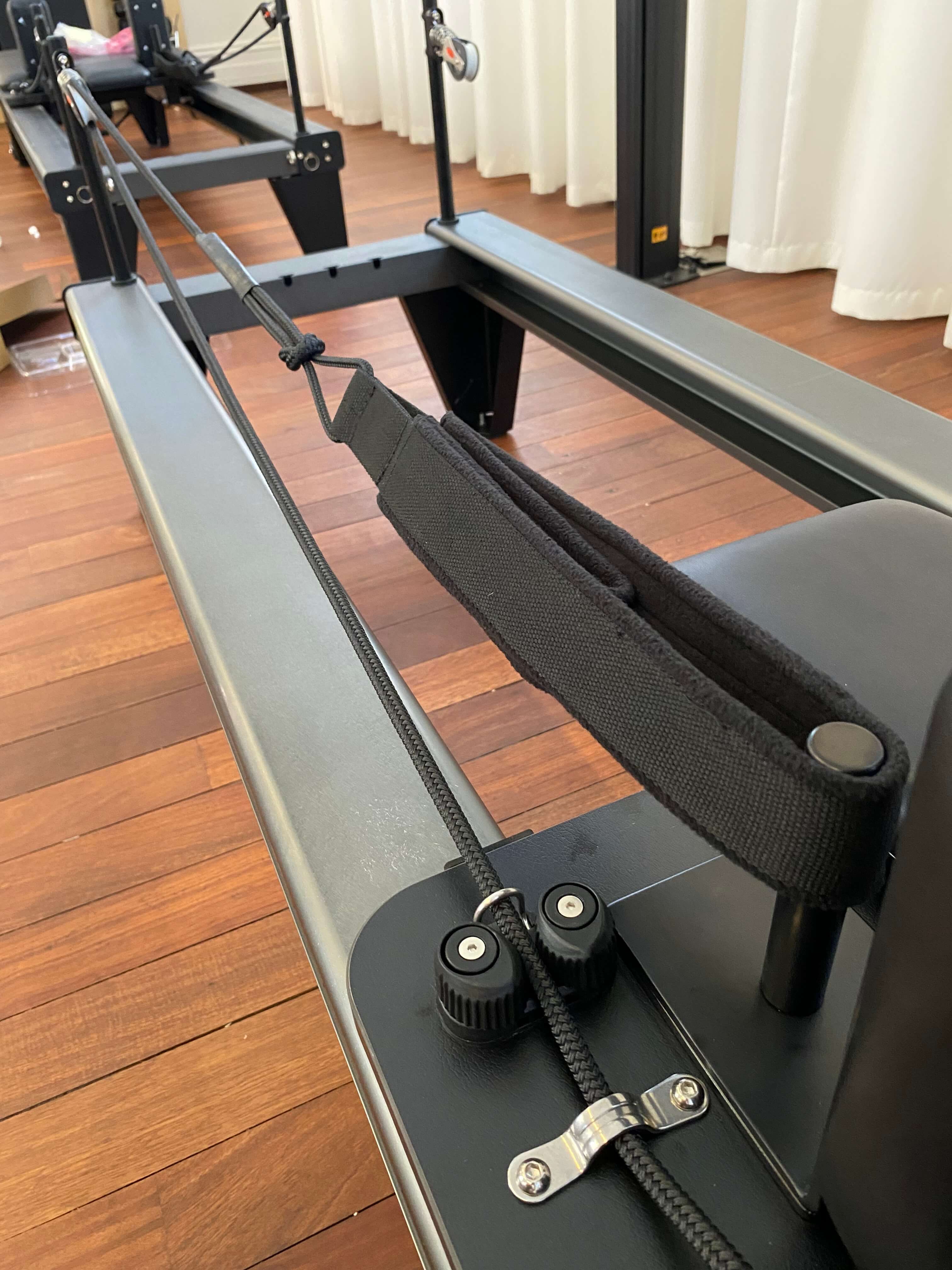 Handle looped over the pole and rope through the locking toggles