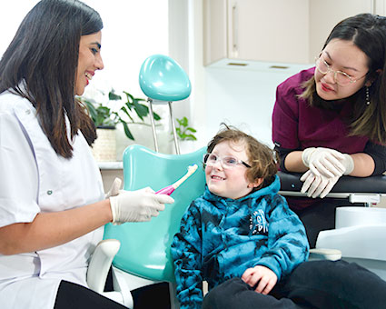 Boy smiling in dental chair