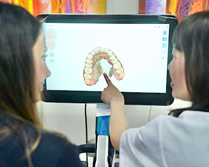 dentist pointing at teeth