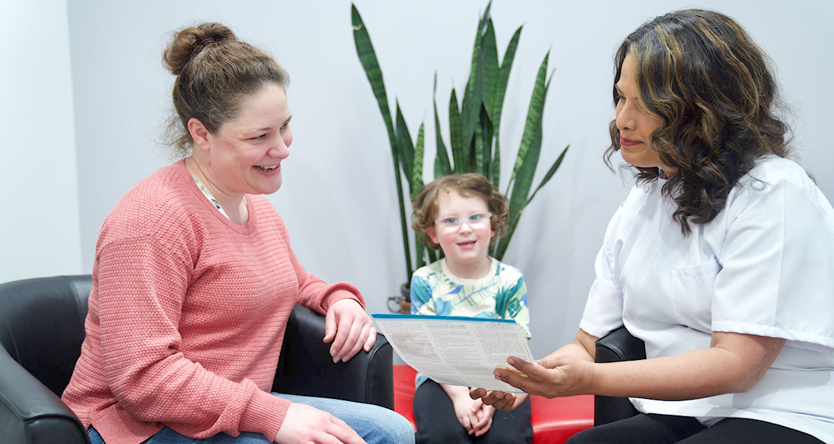 Dentist reviewing information with patient