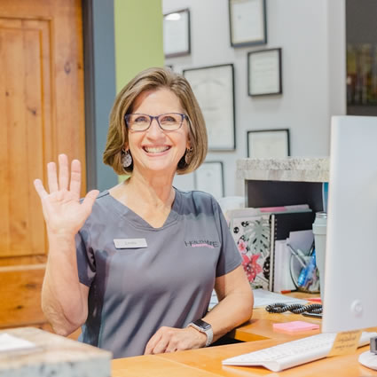 Receptionist waving