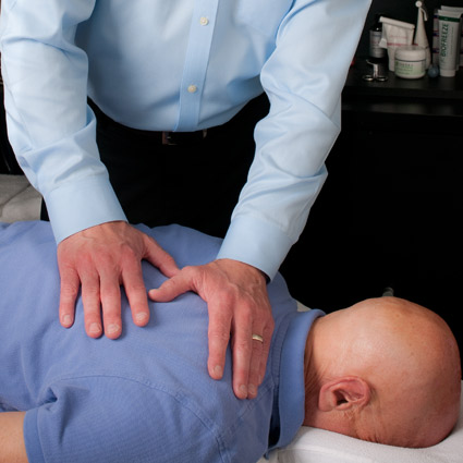 A chiropractic adjustment taking place