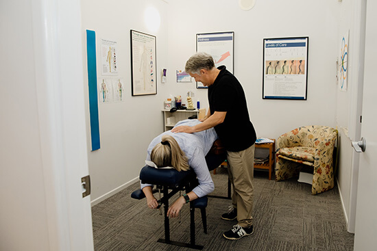 Dr. Bernard, Caboolture Chiropractor, adjusting a patient with back pain