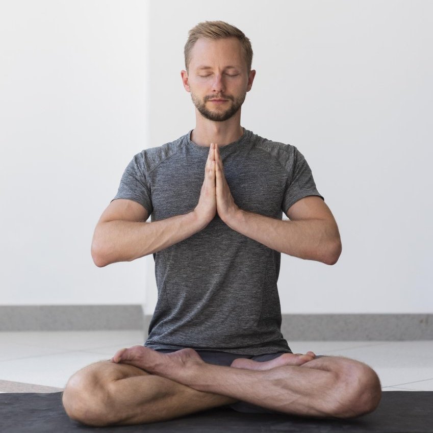 man practicing yoga
