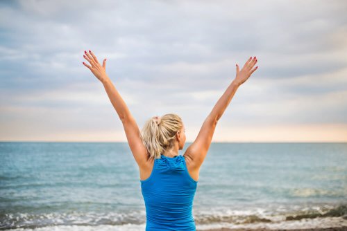 Rear,View,Of,Young,Sporty,Woman,Runner,In,Blue,Sportswear