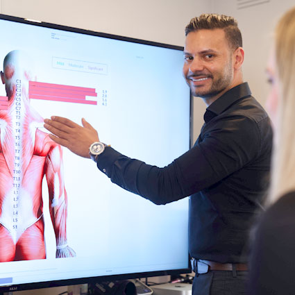 chiropractor pointing at xrays