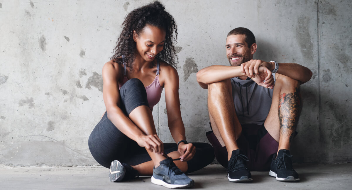 Two adults preparing for exercise