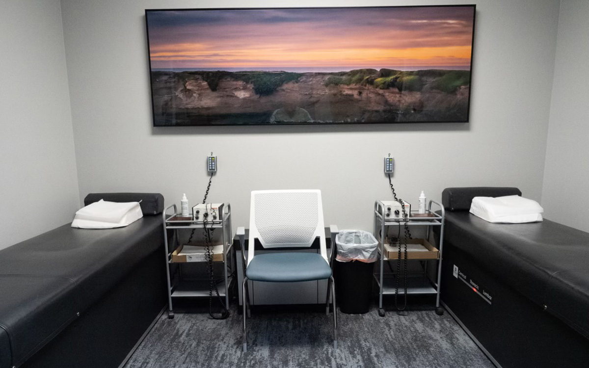 Chiropractic room with two adjustment tables