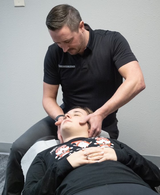 Dr. Nobles adjusting a patients' neck