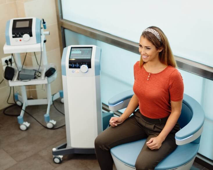 woman in sitting at chiropractic chair