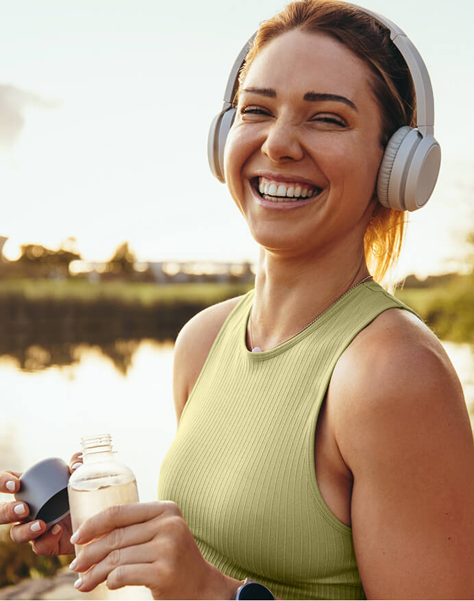 woman smiling with headphones on