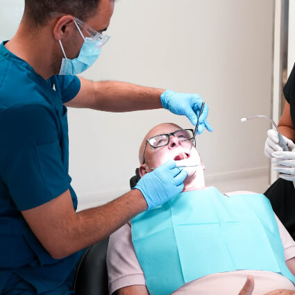 Hervey Bay dentist Dr Knob examining patient in chair