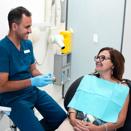 Hervey Bay dentist Dr Felipe talking with patient
