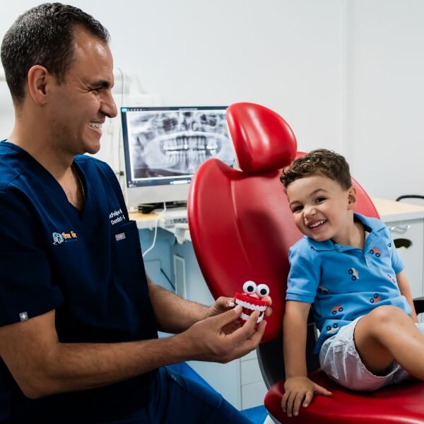 child smiling during dental exam