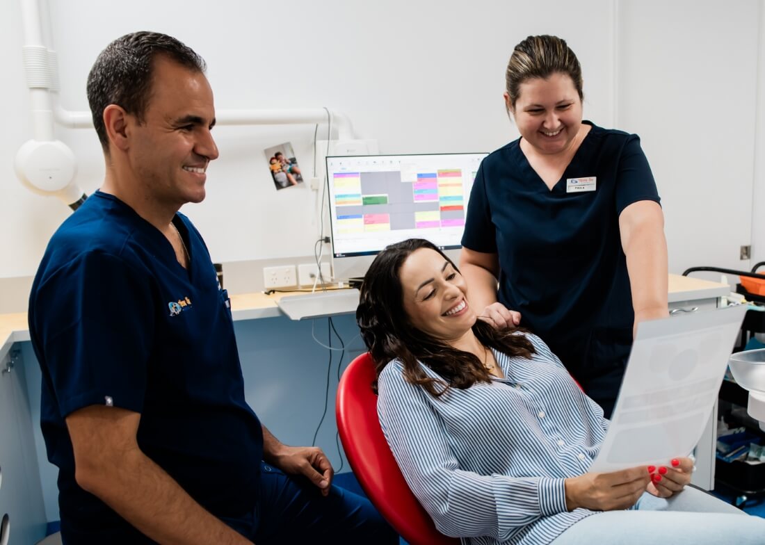 Hervey Bay dentist Dr Felipe talking with staff